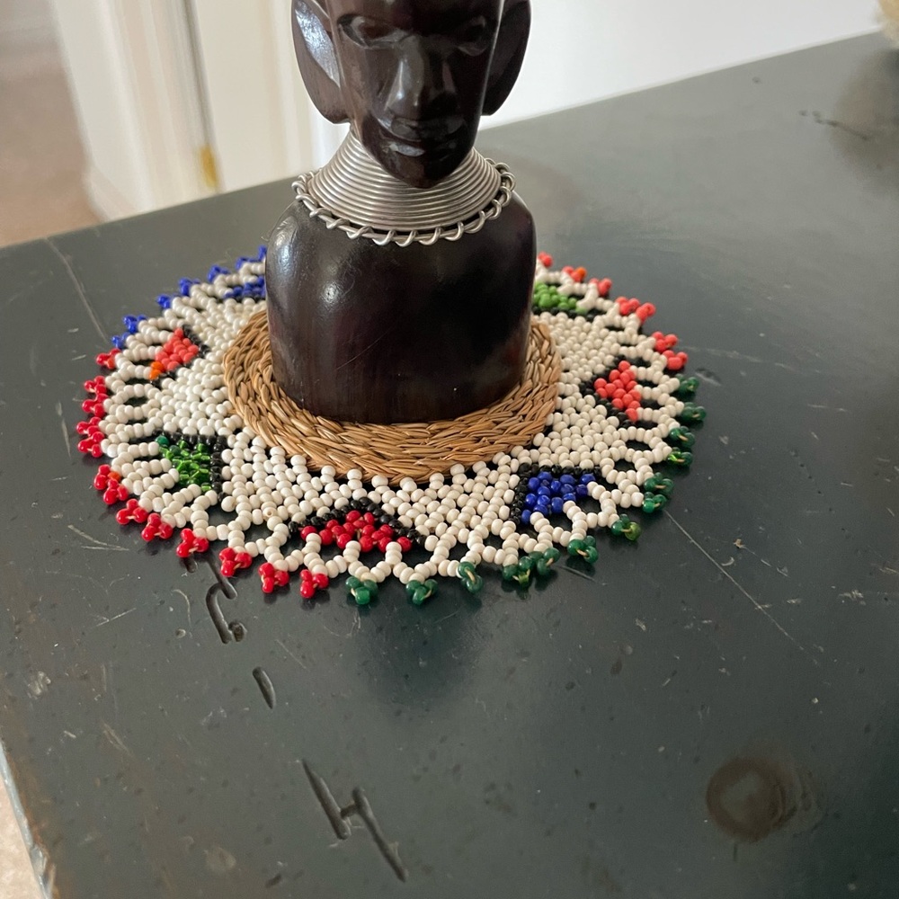 African bust and colorful Beaded rug